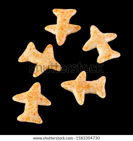 Fried and Spicy Aero Plane Snacks or Fryums (Snacks Pellets) in a background. selective focus - Image Royalty-Free Stock Photo #1583304730