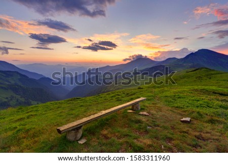 Bench in a very picturesque mountain location in beautiful Rodna mountains, Romania, Europe Royalty-Free Stock Photo #1583311960