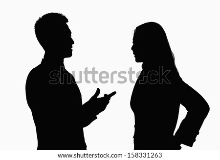 Silhouette of businessman and businesswoman talking.