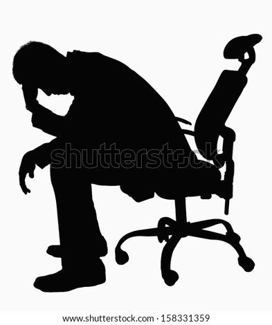 Silhouette of businessman sitting with hand on his head