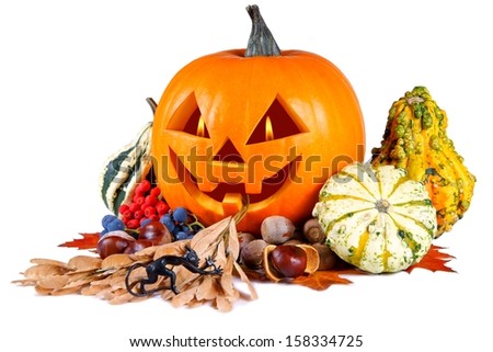 Pumpkin, halloween, old jack-o-lantern on white background with flames in the eyes, composition out of figurine devil