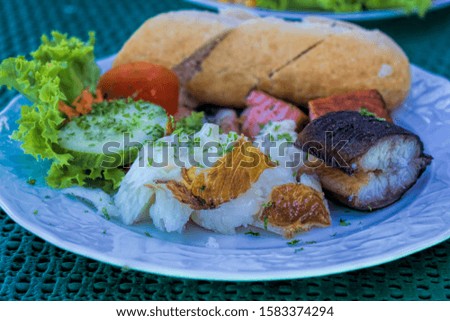 Fish plate with eel, halibut and vegetables
