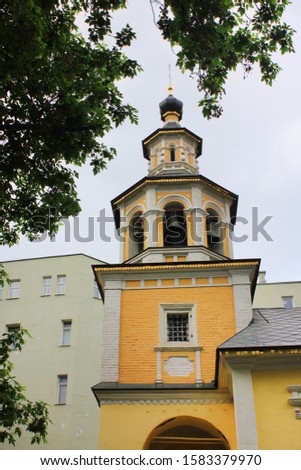 Bell tower of orthodox church on summer day. Scenic vertical view of christian church facade in Moscow, Russia 