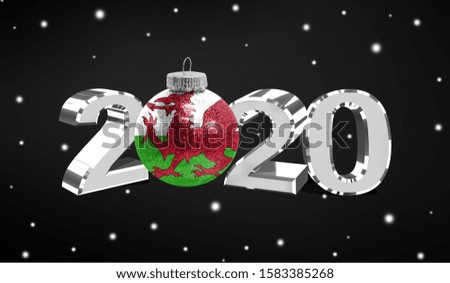 Happy new Year 2020, flag of Wales on a christmas toy, decorations isolated on dark background. Creative christmas concept.