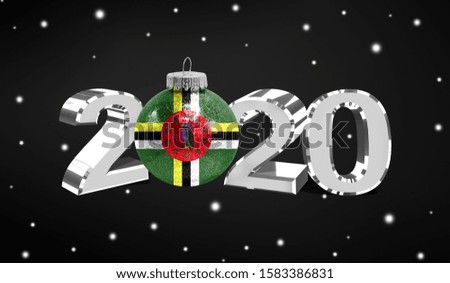 Happy new Year 2020, flag of Dominica on a christmas toy, decorations isolated on dark background. Creative christmas concept.