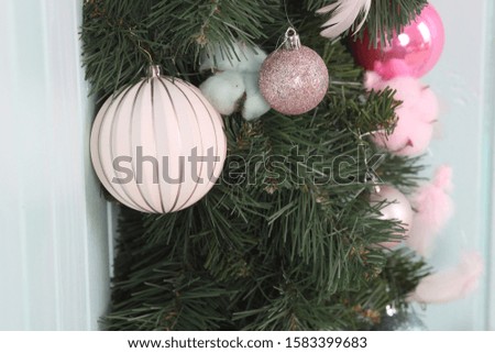 Christmas composition with fir tree branches and holiday ornament