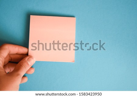 Blank Page of Short Note Book with Human Hand Holding Medical Rubber Glove for Concept and Idea to Write Down, hand gloves copy space