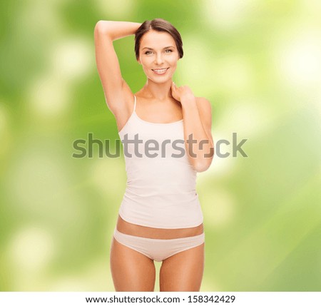 health and beauty, eco, bio, nature concept - beautiful woman in beige cotton underwear