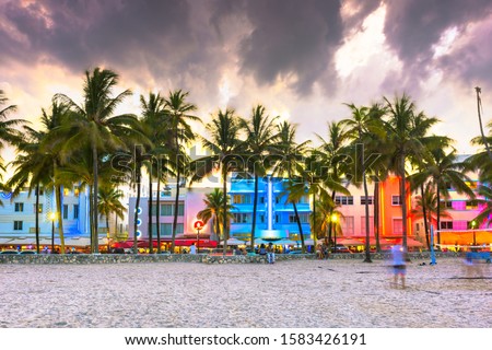 Miami Beach, Florida, USA cityscape with art deco buildings on Ocean Drive at twilight.