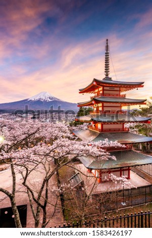 Fujiyoshida, Japan at Chureito Pagoda and Mt. Fuji in the spring with cherry blossoms. Royalty-Free Stock Photo #1583426197