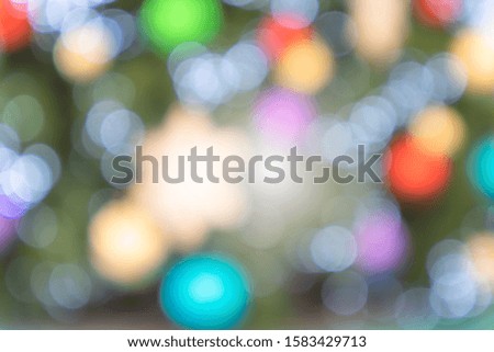 Colorful Red,Yellow and Green Christmas tree bokeh background of de focused glitterng lights, Christmas background pattern concept.