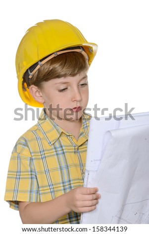 Cute kid while wearing construction helmet and holding plans, isolated on white background