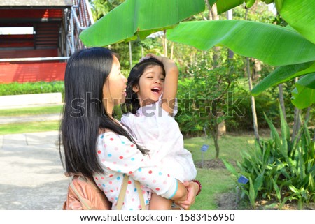 Beautiful Portrait of Little Child Girl Mixed Race Thai Russia Pakistan at Sireeruckhachati Nature Learning Park Nakhon Pathom Thailand