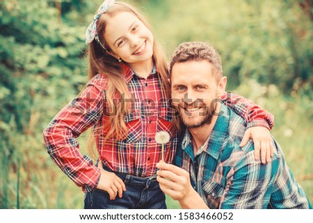 daughter and father with dandelion. spring village country. ecology. Happy family day. little girl and happy man dad. earth day. family summer farm. Helping in garden.