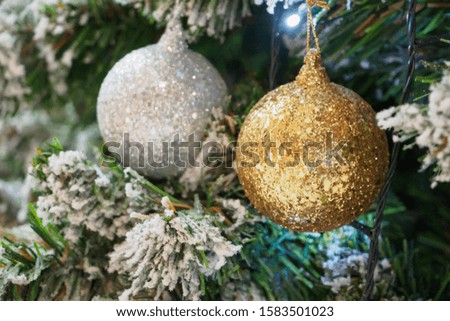 Decorated Christmas ball on tree New Year holidays background