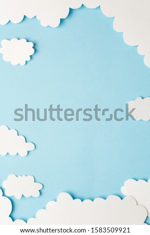 beautiful blue background with light clouds of paper, vertical Royalty-Free Stock Photo #1583509921