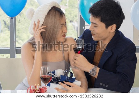 Happy young Asian Male and Female Couples Celebrating at Christmas and new years eve party or valentine's day. Holidays, love, relationship and dating concept.