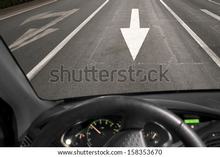 Car driving against traffic on asphalt road