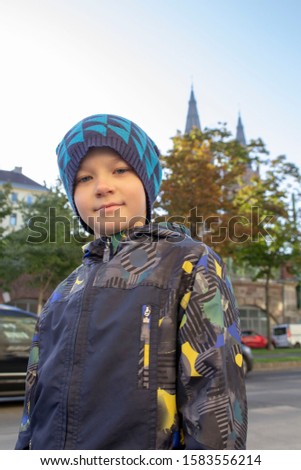 boy on the background of an ancient castle with gabled towers