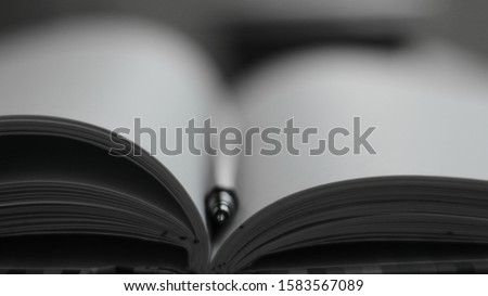 photo of a notebook and a pen/pecil perfect  stock photo for websites of schools/offices/more. It can be used for image in carousel. It can be used as a background for posters and news articles.