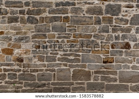 decorative old church wall with natural stones, authentic