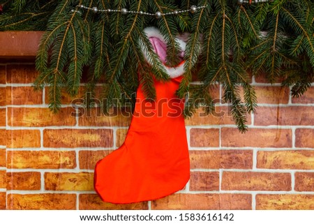 Branches of fir tree and christmas stocking