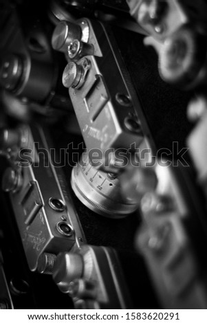 Old Soviet film cameras pattern. Vintage camera closeup background. Retro photo equipment screensaver. Photographic equipment, equipment for photography. Different photo accessories for shooting.  