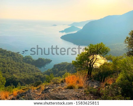 view from the hillside to sunset over the sea