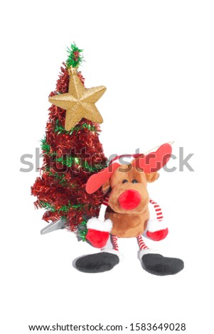 Brown reindeer, red ears, black feet  There is a red Christmas tree on the side.  Atop a Christmas tree decorated with gold stars and a white background.isolate