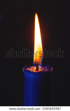 Candle Macro Closeup. Candle flame on a dark background