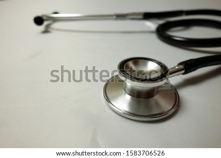 Medical background with stethoscope on doctor desk