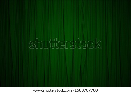 Theater stage and curtain illuminated by stage light
