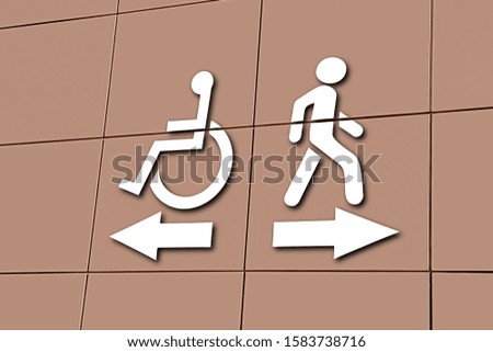 entrance sign pointer direction motion the wheelchair on the building corne