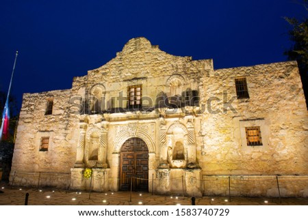 The Alamo Mission at night in downtown San Antonio, Texas, USA. The Mission is a part of the San Antonio Missions World Heritage Site.