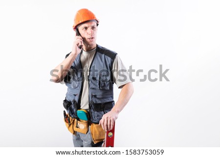 Builder talking on a cell phone.