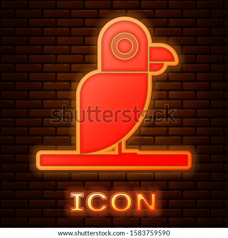 Glowing neon Pirate parrot icon isolated on brick wall background.  Vector Illustration