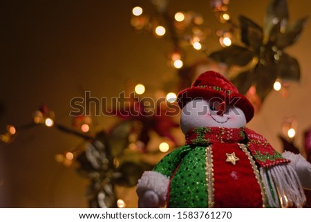 snowman doll with background tree
