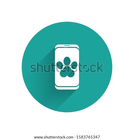 White Online veterinary clinic symbol icon isolated with long shadow. Cross with dog veterinary care. Pet First Aid sign. Green circle button. Vector Illustration