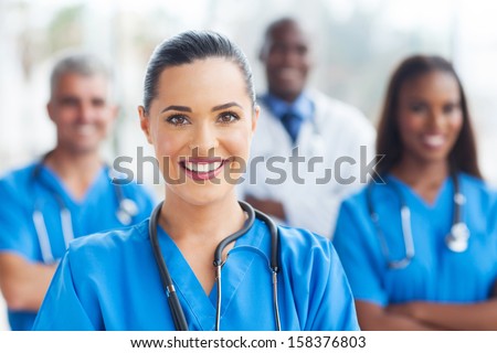 beautiful medical nurse and colleagues in hospital Royalty-Free Stock Photo #158376803