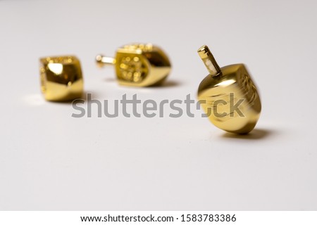 Gold Dreidel spinning top Hanukkah traditional toy Jewish holiday 