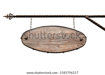 Oval wooden signboard. Old wooden oval shop signs without text hanging on the wrought iron structure. Template is isolated on white. Blank for creativity and design.