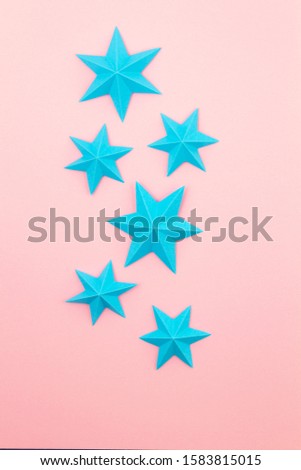 Abstract background with colorful paper origami stars. Holiday, celebration, birthday, greeting card, invitation, diy concept. Flat lay, top view