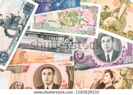 North Korea Won banknotes background. High resolution vintage photo of North Korean bill 2, DPRK money close-up macro.