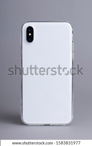 Clear iPhone X case mock up close up. Smart phone in transparent case back view isolated on gray background