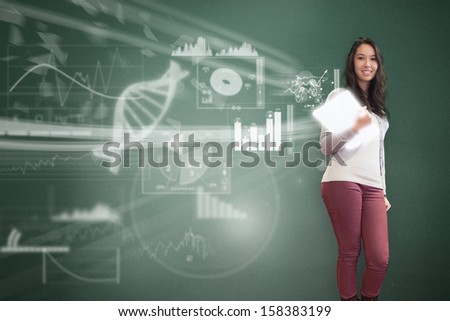 Smiling student posing on digital background with diagrams and charts