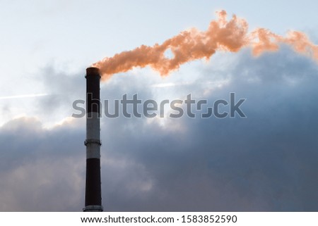 emission at the enterprise from a pipe of poisonous gas nitric oxide, nitrogen dioxide. Royalty-Free Stock Photo #1583852590