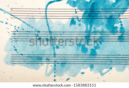 Old music sheet in blue watercolor paint. Blues music concept. Abstract blue watercolor background. 