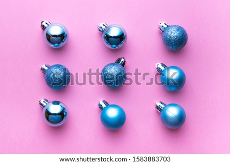 Xmas pattern. Christmas balls for decorations isolated on pink background. Flat lay. Abstract winter concept.