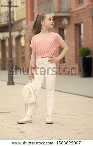 Little child enjoy walk. Summer is here. Summer vacation and tourism. Girl carefree child. Happy day. Kid long hair enjoy walk sunny day. Summer holidays relax. Charming stylish fashionable girl.