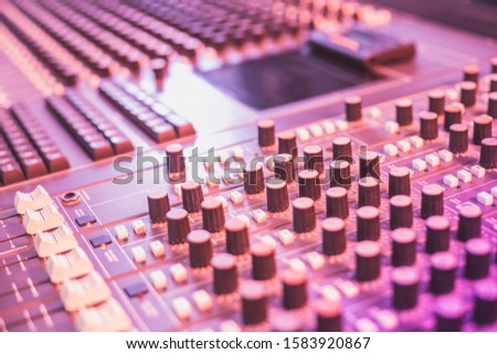 Recording music studio buttons and wires up close and colourful